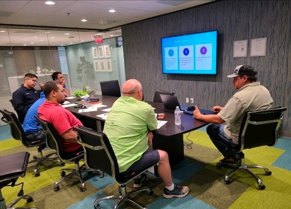 Supervisors in a competent person training session reviewing OSHA excavation requirements