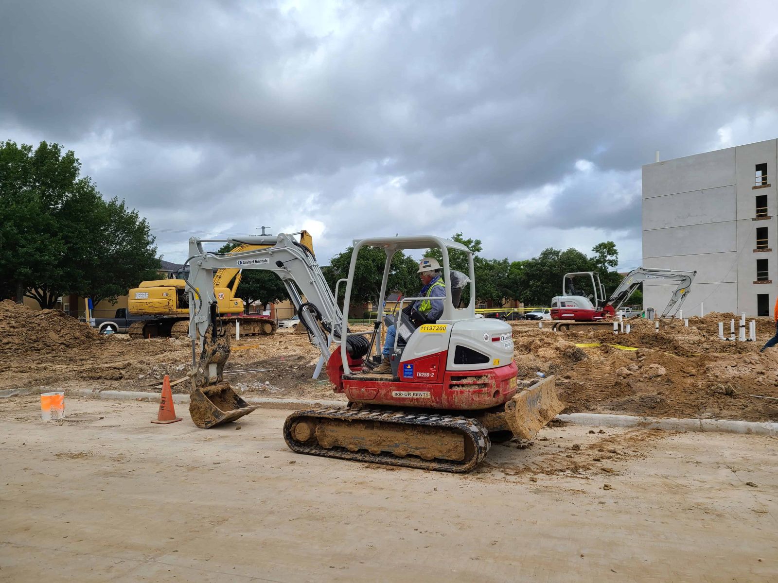 Operator running a mini excavator during hands-on civil equipment training